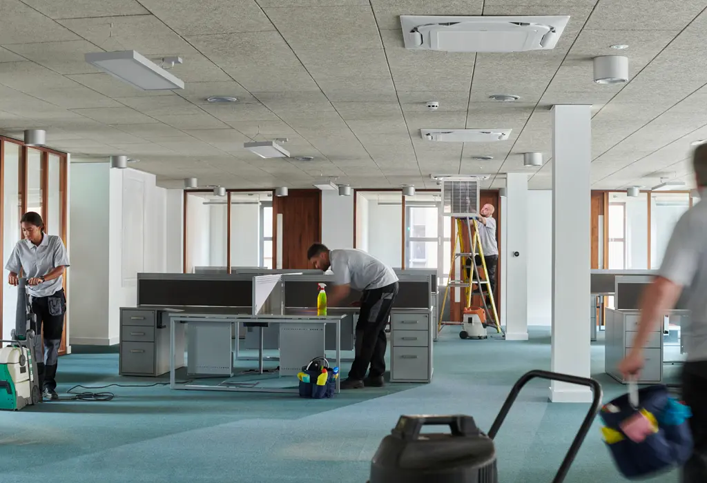 Facility services team working in an office.