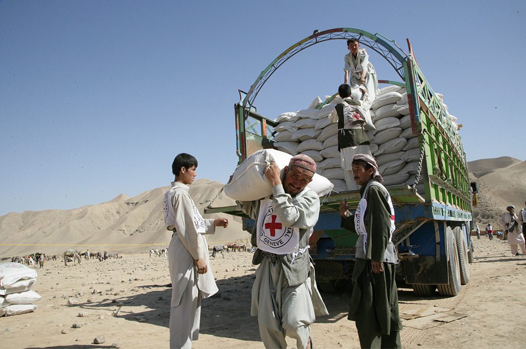 Red Cross delivers aid in conflict zone.