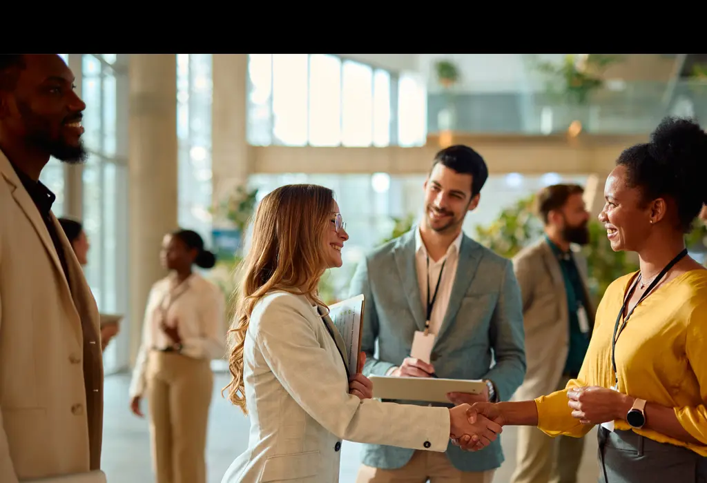 Handshake between two businesswomen.