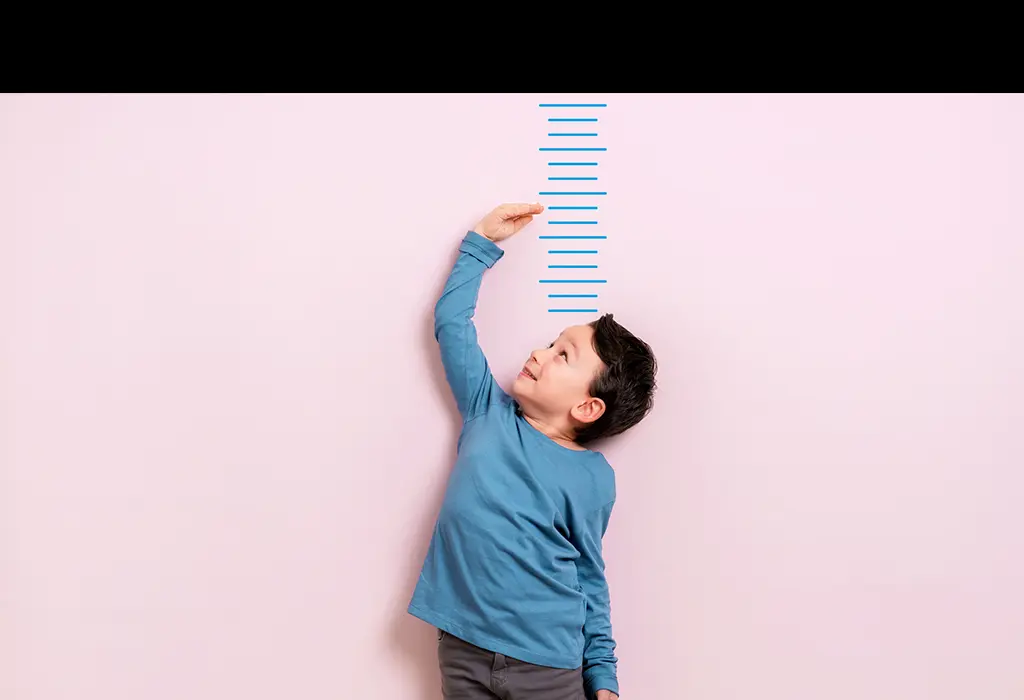 Kid measuring his height.
