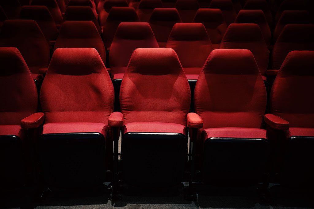 Empty cinema chairs.