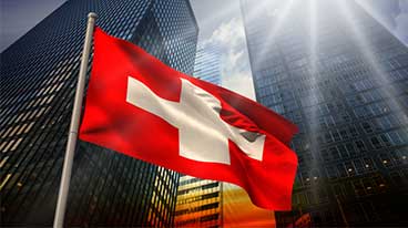 https://www.iese.edu/insight/wp-content/uploads/sites/3/2025/03/swiss-flag-buildings.jpg