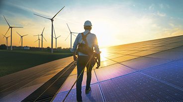 https://www.iese.edu/insight/wp-content/uploads/sites/3/2025/05/solar-panel-worker.jpg