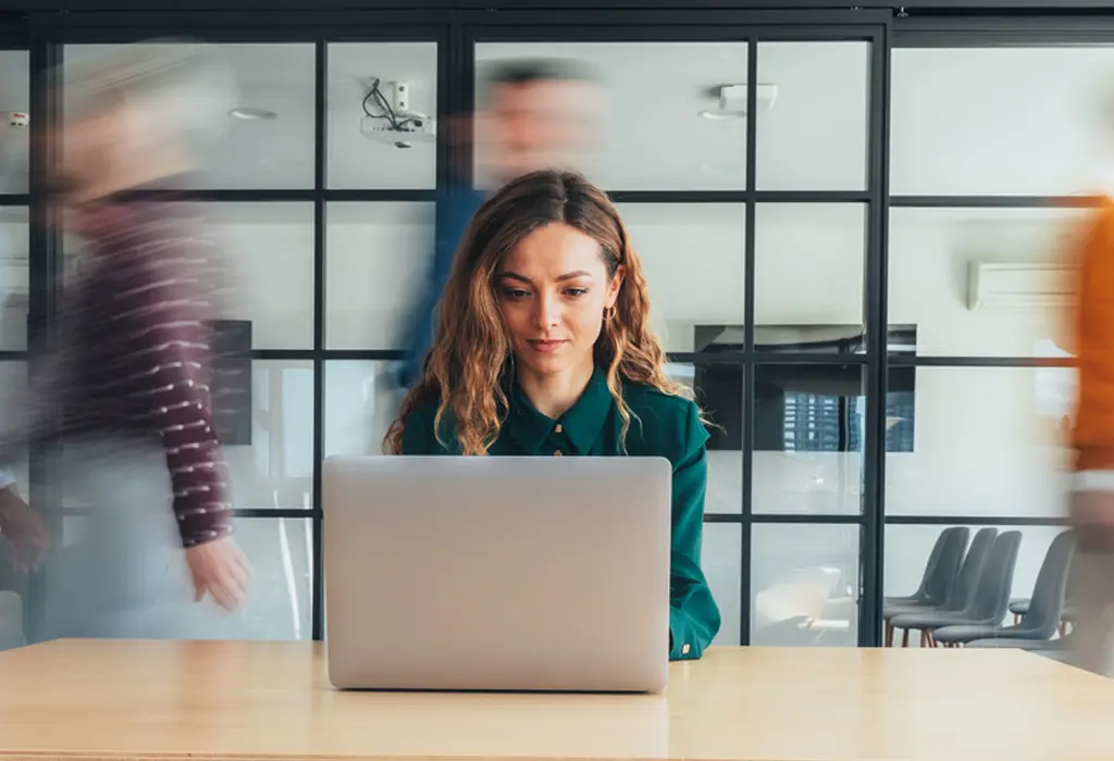 Woman working with her laptop in the office.